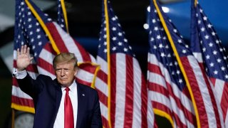 U.S. President Donald Trump waves as he concludes his remarks during a campaign rally at Newport News/Williamsburg International Airport on Sept. 25, 2020 in Newport News, Virginia.