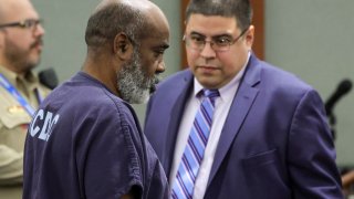 FILE - Duane Davis (L), with deputy special public defender Robert Arroyo, appears in Clark County District Court