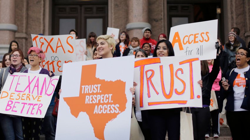 FILE – In this Feb. 26, 2015 file photo, college students and abortion rights activists hold signs during a rally on the steps of the Texas Capitol, in Austin, Texas. The Biden administration cannot use a 1986 emergency care law to require hospitals in Texas hospitals to provide abortions for women whose lives are at risk due to pregnancy, a federal appeals court ruled Tuesday, Jan. 2, 2024. It’s one of numerous cases involving abortion restrictions that are playing out in state and federal courts after the U.S. Supreme Court ended abortion rights in 2022. (AP Photo/Eric Gay, File)