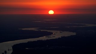 FILE - Ships travel along the Mississippi River in LaPlace, La., as the sun sets on Oct. 20, 2023. The nation’s rivers and streams remain stubbornly polluted with nutrients that can contaminate drinking water, degrade aquatic life and feed the so-called “dead zone” in the Gulf of Mexico, according to a recently released Environmental Protection Agency assessment.