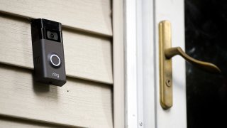 FILE - A Ring doorbell camera is seen installed outside a home in Wolcott, Conn., July 16, 2019.