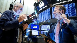 Traders work on the floor at the New York Stock Exchange, November 4, 2019.