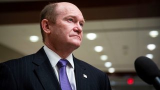 U.S. Sen. Chris Coons, D-Del., speaks to reporters during a break from a Senate Armed Services and Foreign Relations joint briefing on the U.S. policy on Afghanistan, on Capitol Hill in Washington, D.C., on Feb. 2, 2022.