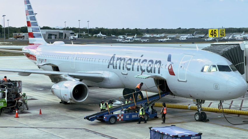 An American Airlines plane sits at the gate at Cancun International Airport on May 26, 2023.