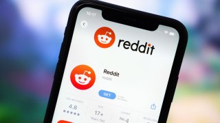 In this photo illustration, the Reddit app logo is displayed in the App Store on an iPhone. (Photo Illustration by Sheldon Cooper/SOPA Images/LightRocket via Getty Images)