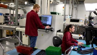 Workers assemble printed circuit boards at the Intervala manufacturing facility in Mount Pleasant, Pennsylvania, US, on Tuesday, Jan. 30, 2024. The US Census Bureau is scheduled to release factory orders figures on February 2.