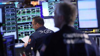 Traders work on the floor of the New York Stock Exchange during morning trading on January 31, 2024 in New York City. 