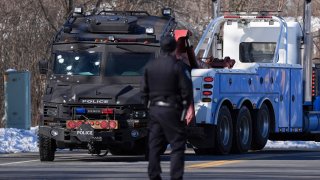 A police vehicle with what appears to be bullet pockmarks