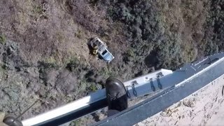 A crew rescues a driver who plunged down a cliff in the Big Sur area.