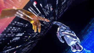 File. Digital generated image of hand with dark skin tone going through portal and touching robotic hand. Metaverse and Web3.0 concept.