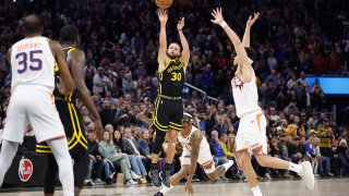 SAN FRANCISCO, CALIFORNIA – FEBRUARY 10: Stephen Curry #30 of the Golden State Warriors makes a go-ahead three-point basket late in the fourth quarter against the Phoenix Suns at Chase Center on February 10, 2024 in San Francisco, California.  (Photo by Lachlan Cunningham/Getty Images)