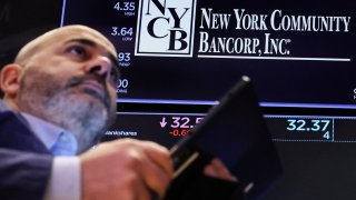 Traders work on the floor at the New York Stock Exchange (NYSE) in New York City, U.S., February 7, 2024.