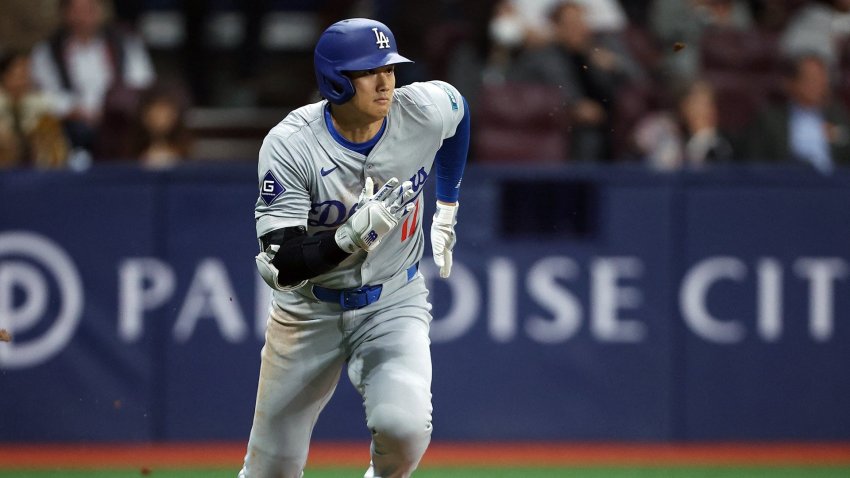 Shohei Ohtani runs after a hit