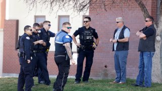 A heavy police presence gathers outside of the Twin Falls Court House while two of the suspects in an attack on corrections officers at a Boise, Idaho, hospital