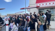 Former employees of the Oakland In-N-Out gather for a group photo on the restaurant's last day of operation. March 24, 2024. NBC Bay Area Photo/ Alyssa Goard.