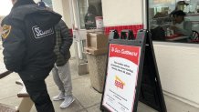 A sign outside the Oakland In-N-Out advises customers that the location will be permanently closed starting Monday, March 25, 2024. NBC Bay Area Photo/ Alyssa Goard.