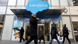 People pass by the Salesforce Tower and Salesforce.com offices in New York City on March 7, 2019.