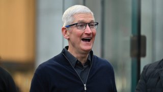 Apple CEO Tim Cook greets customers as he arrives for the release of the Vision Pro headset at the Apple Store in New York City on Feb. 2, 2024.