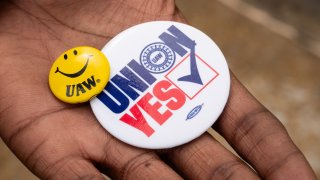 FILE -- Kelcey Smith displays UAW buttons in Chattanooga, Tennessee on April 10, 2024.