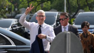 Apple CEO Tim Cook gestures as he arrives for a meeting with Indonesia’s President Joko Widodo at the Merdeka Palace in Jakarta on April 17, 2024.