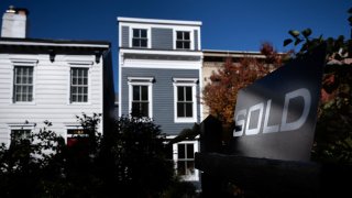 A residential real estate sold sign is seen in Washington, D.C.