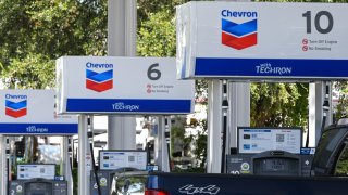 Gas pumps are seen at a Chevron gas station in Orlando.