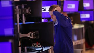 Traders work on the floor of the New York Stock Exchange during morning trading on April 29, 2024 in New York City.