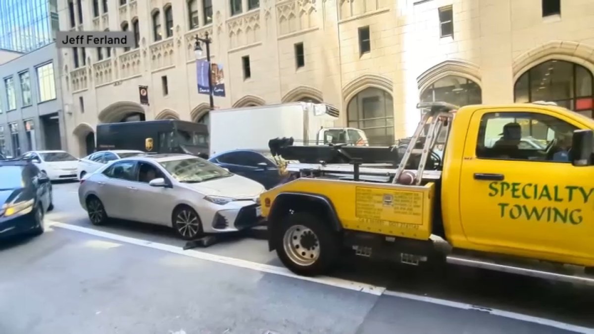 Video shows tow truck try to latch onto moving car in San Francisco