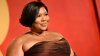 Lizzo clarifies comments on quitting