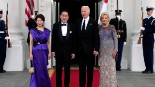 President Joe Biden, center right, and first lady Jill Biden, right, welcome Japanese Prime Minister Fumio Kishida, center left, and his wife Yuko Kishida.