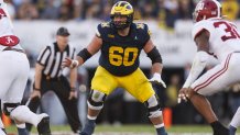 PASADENA, CALIFORNIA - JANUARY 01: Offensive lineman Drake Nugent #60 of the Michigan Wolverines blocks during the CFP Semifinal Rose Bowl Game against the Alabama Crimson Tide at Rose Bowl Stadium on January 1, 2024 in Pasadena, California. (Photo by Ryan Kang/Getty Images)