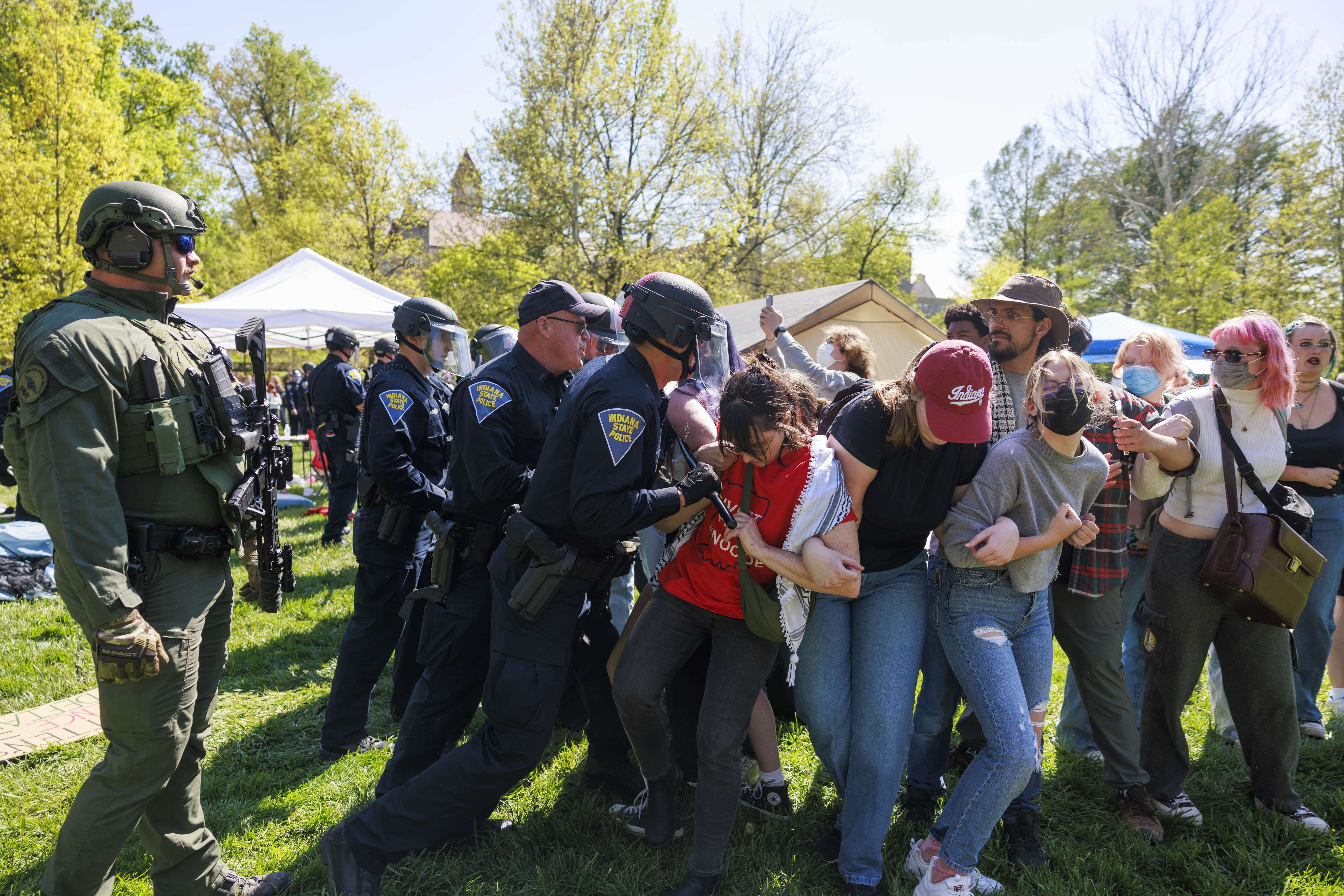 Indiana State Police arrest dozens of people during a pro-Palestinian protest on the Indiana University campus in Bloomington, Ind. on Thursday, April 25, 2024.