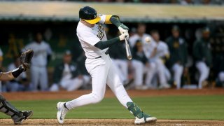 OAKLAND, CALIFORNIA – APRIL 29: Tyler Nevin #26 of the Oakland Athletics hits a sacrifice fly that scored a run against the Pittsburgh Pirates in the fifth inning at Oakland Coliseum on April 29, 2024 in Oakland, California. (Photo by Ezra Shaw/Getty Images)