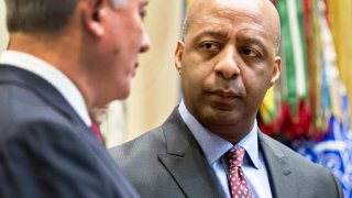 Marvin Ellison, Chairman and Chief Executive Officer of J.C. Penney Co. Inc., right, talks to Greg Sandfort, Chief Executive Officer officer of Tractor Supply Co., before a listening session with President Donald Trump and the Retail Industry Leaders Association in the Roosevelt Room of the White House on February 15, 2017 in Washington, D.C.