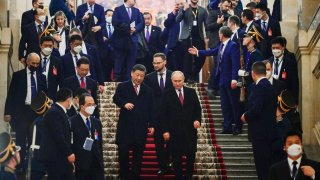 Russian President Vladimir Putin and China’s President Xi Jinping leave after a reception following their talks at the Kremlin in Moscow on March 21, 2023.