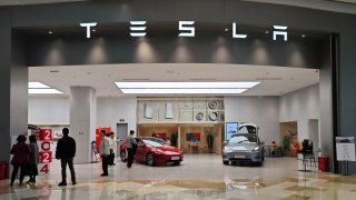 People are shopping at a Tesla store in Shanghai, China, on Feb. 17, 2024.