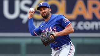 Marcus Semien of the Texas Rangers throws to first base to get out Trevor Larnach #9 of the Minnesota Twins during the fifth inning at Target Field on May 26, 2024 in Minneapolis, Minnesota.