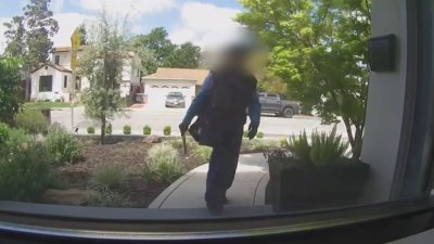 Officials release footage of suspected vehicle involved in mail carrier robbery