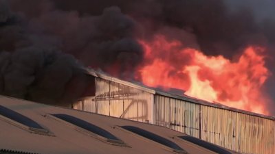 Crews battle 4-alarm fire at Oakland lumber yard