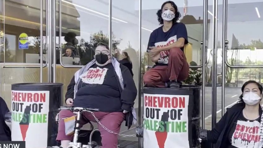 Members of the Oil and Gas Action Network gathered and blocked the entrance to Chevron’s global headquarters asking the company to divest.