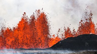 A volcano spews lava in Grindavik, Iceland.