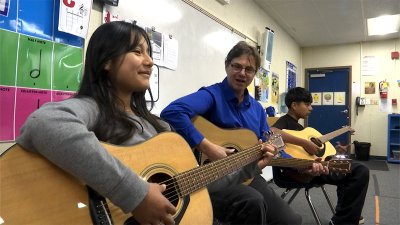 Guitar Donation Lifts Spirits Of Students In Flood-Ravaged Community