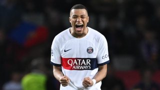 Kylian Mbappe of Paris Saint-Germain celebrates victory in the UEFA Champions League quarter-final second leg match between FC Barcelona and Paris Saint-Germain at Estadi Olimpic Lluis Companys on April 16, 2024 in Barcelona, Spain.