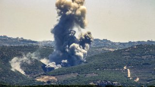 TOPSHOT – Smoke billows from the site of an Israeli airstrike on Zibqin in southern Lebanon on June 12, 2024.