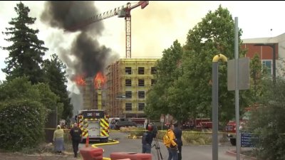 Fire destroys apartment under construction