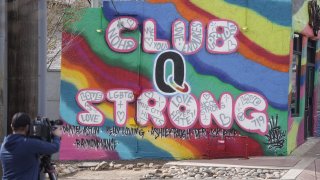 A tribute to the victims of a mass shooting at a gay nightclub painted on the side of a downtown commercial building in Colorado Springs