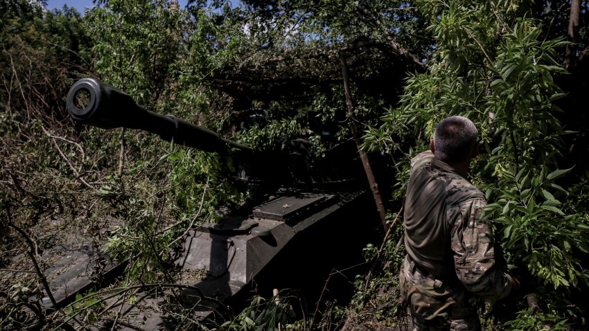 a soldier prepares to fire a "Gvozdika"