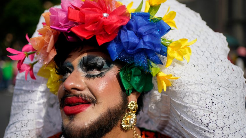 A participant poses for a photo during the annual Gay Pride parade