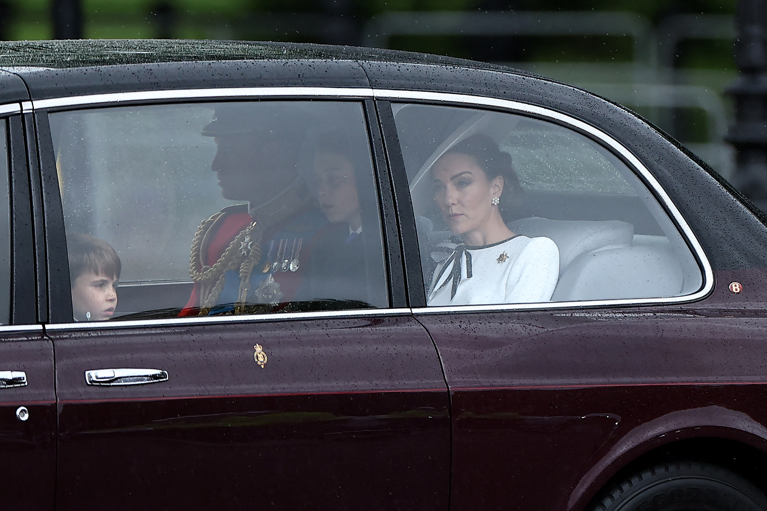 Britain’s Catherine, Princess of Wales, (R) arrives with Britain’s Prince William, Prince of Wales, (rear C) and their children Britain’s Prince George of Wales (C) and Britain’s Prince Louis of Wales (L) to Buckingham Palace before the King’s Birthday Parade “Trooping the Colour” in London on June 15, 2024. The ceremony of Trooping the Colour is believed to have first been performed during the reign of King Charles II. Since 1748, the Trooping of the Colour has marked the official birthday of the British Sovereign. Over 1500 parading soldiers and almost 300 horses take part in the event.