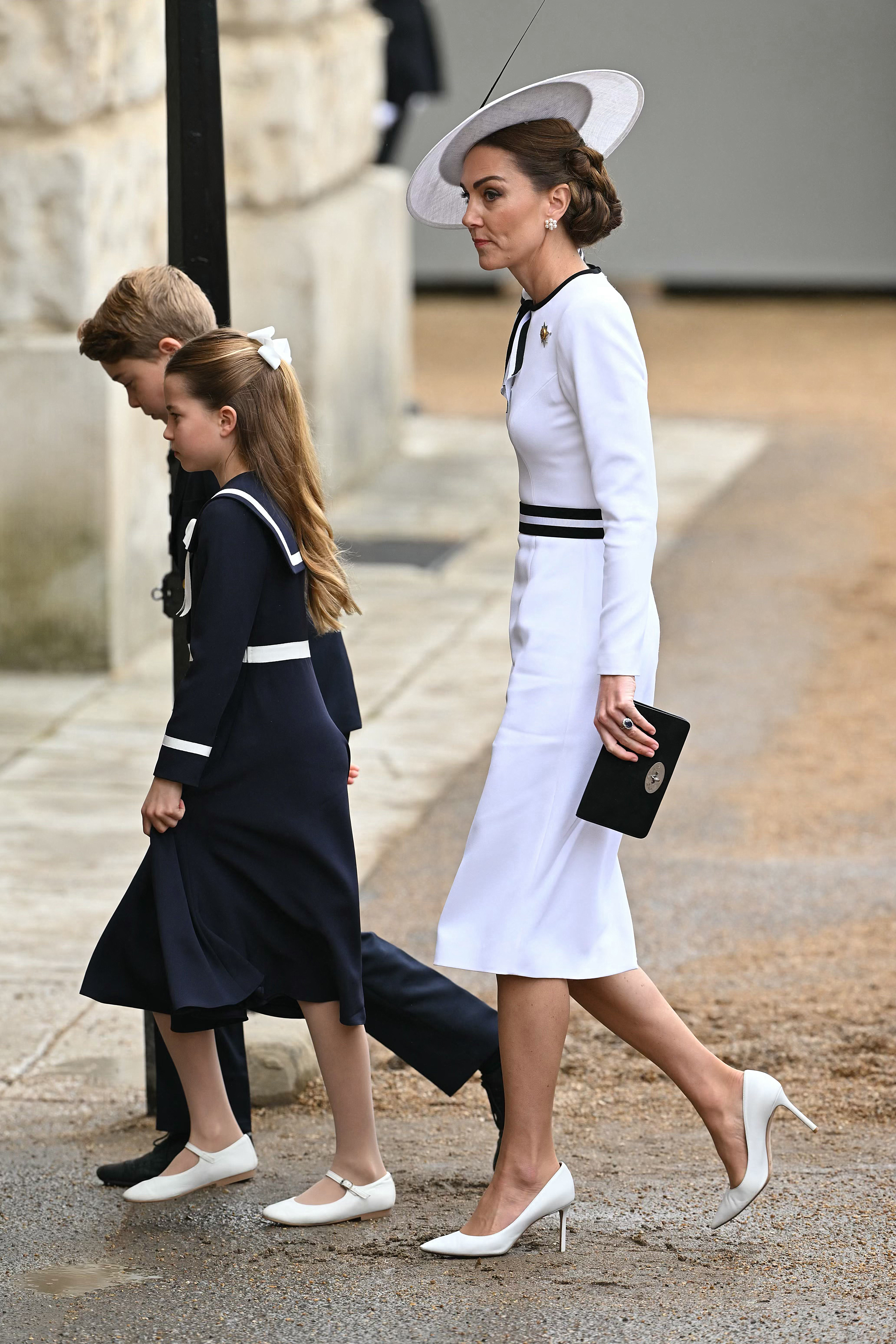 Britain’s Catherine, Princess of Wales, arrives with Britain’s Princess Charlotte of Wales and Britain’s Prince George of Wales to Horse Guards Parade for the King’s Birthday Parade “Trooping the Colour” in London on June 15, 2024. Catherine, Princess of Wales, is making a tentative return to public life for the first time since being diagnosed with cancer, attending the Trooping the Colour military parade in central London.